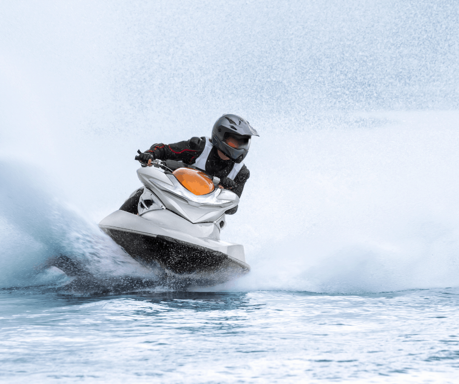 A person slips off a jet ski.